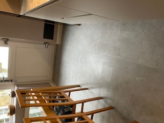 Stone-effect vinyl tile flooring fitted in a kitchen diner
